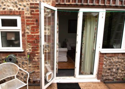 Entrance from secure courtyard into living room at Chapel Barn Sheringham
