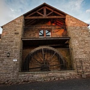 Mill Barn @ Tottergill Farm | 4-Bed Upside-Down Barn with Water Wheel & Hot Tub